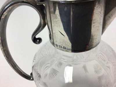 Lot 103 - Edwardian silver mounted cut glass claret jug, with scroll handle, Birmingham 1907, 24cm high