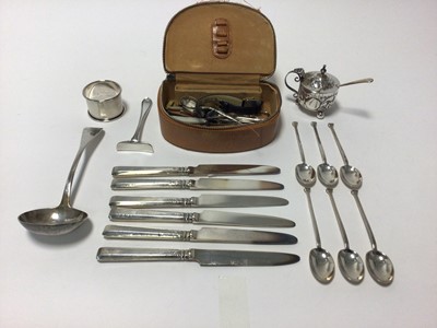 Lot 104 - Group of silver, including six seal top teaspoons, a Victorian ladle, mustard on bun feet, six silver handled knives and a pusher, together with objets vertu in case