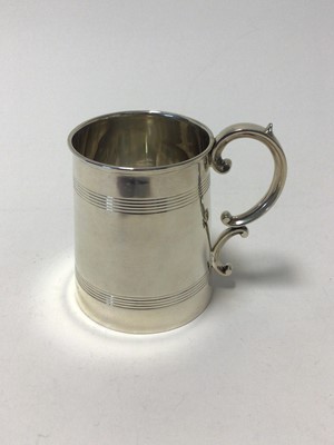 Lot 111 - Edwardian silver mug, with double scroll handle and ribbed decoration, 9.5cm high, Birmingham 1904 (William Aitken), 6.3oz