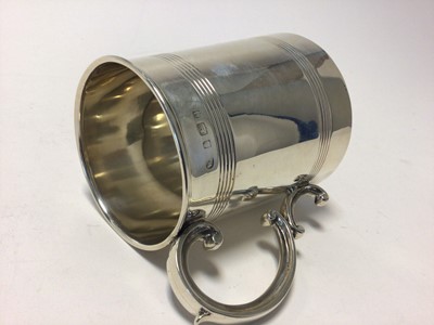 Lot 111 - Edwardian silver mug, with double scroll handle and ribbed decoration, 9.5cm high, Birmingham 1904 (William Aitken), 6.3oz