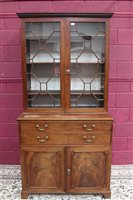 Lot 1321 - George III mahogany secretaire bookcase with...