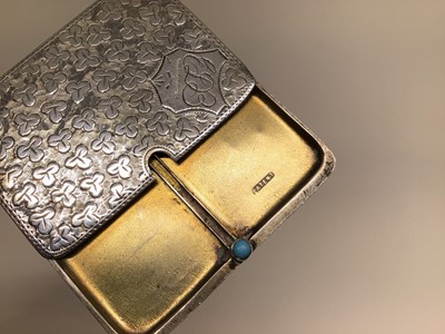 Lot 124 - A rectangular silver double postage stamp case, with sliding action, cabochon turquoise thumb piece, and engine turned foliate decoration, 5.25cm x 3.75cm, Birmingham 1910 (Ahronsberg Brothers)