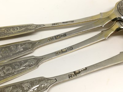 Lot 126 - Set of four silver and silver gilt Imperial Russian teaspoons with engraved decoration, hallmarked Moscow 1877-1917, 2.4oz