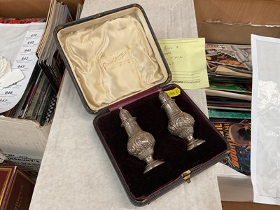 Lot 1155 - Pair of silver pepperettes in fitted case