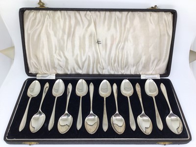 Lot 129 - Cased set of 12 silver coffee spoons, Birmingham 1934 (H. Tatton & Sons), 4.5oz