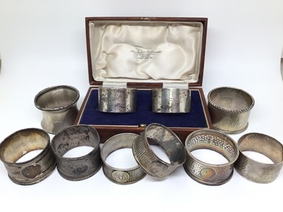 Lot 149 - Group of nine silver napkin rings
