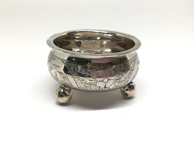 Lot 130 - Imperial Russian silver salt cellar, of cauldron form on three bun feet, with engraved decoration, Moscow 1875 (Ivan Prokofiev, assay master S. Svyechin), together with a pair of Imperial Russian s...