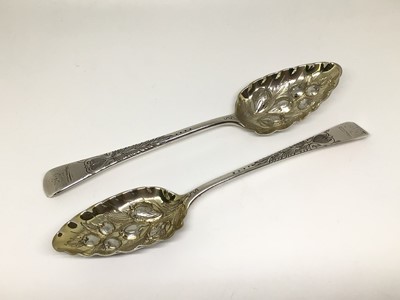 Lot 134 - Pair of George III silver and silver gilt berry spoons, later decoration, 22cm long, London 1799 (George Smith), 4.6oz