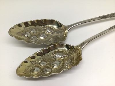 Lot 134 - Pair of George III silver and silver gilt berry spoons, later decoration, 22cm long, London 1799 (George Smith), 4.6oz