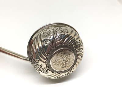Lot 136 - Georgian silver punch ladle with George II coin and whalebone handle, 39cm long