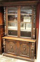 Lot 1331 - 19th century Continental carved oak bookcase,...