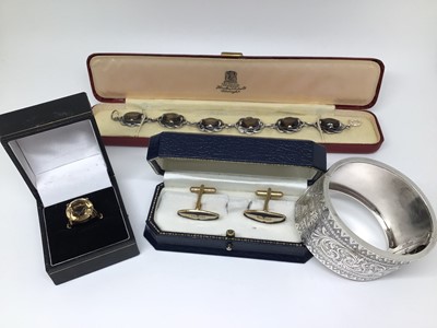 Lot 142 - Group of jewellery to include a silver and smoky quartz bracelet, 9ct gold smoky quartz ring, Victorian silver hinged bangle and a pair of Aston Martin cufflinks