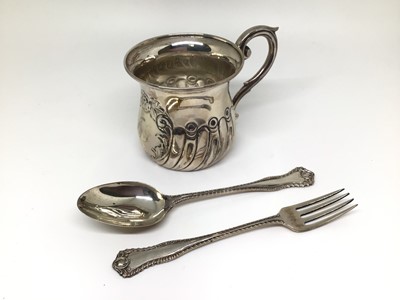Lot 143 - An Edwardian silver Christening set in fitted case, comprising mug, fork and spoon, Birmingham 1905, 2.7oz