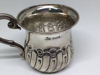 Lot 143 - An Edwardian silver Christening set in fitted case, comprising mug, fork and spoon, Birmingham 1905, 2.7oz
