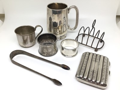Lot 146 - Group of silver, including a mug and cup, two napkin rings, a toast rack and a cigarette case (two pieces continental and the rest sterling), 10oz
