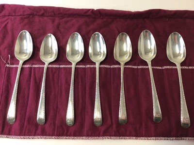 Lot 155 - Set of seven George III feather edged spoons (London 1767, some marks worn), 18cm long, 8.5oz