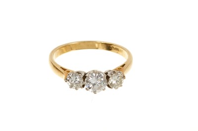 Lot 694 - 18ct gold three stone diamond ring