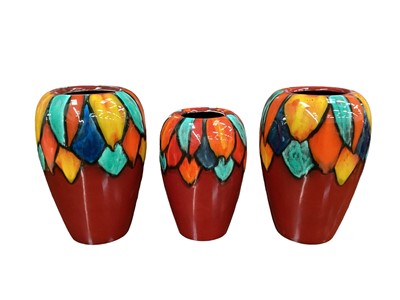 Lot 1113 - Pair of Poole pottery Harlequin Concave vases together with a smaller vase