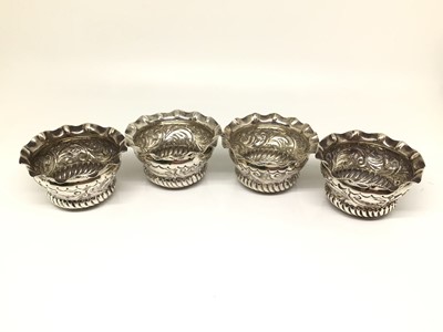 Lot 159 - Set of four Victorian floral silver bowls with scrolling patterns in relief, 5.5cm diameter, Birmingham 1899 (Deakin & Francis Ltd), 2.3oz