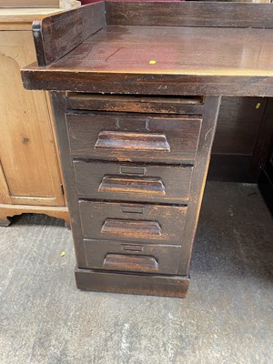 Lot 141 - 1920s oak twin pedestal desk with an arrangement of drawers