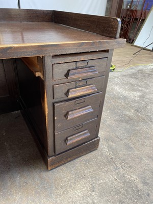 Lot 141 - 1920s oak twin pedestal desk with an arrangement of drawers