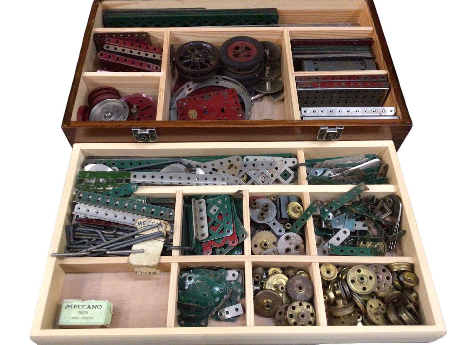 Lot 1906 - Meccano wooden box containing selection including gears, wheels, base plates.  Three boxes of early accessories 1A (1920's) and later boxed sets and lots of spares