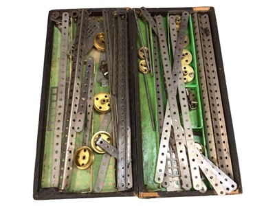 Lot 1906 - Meccano wooden box containing selection including gears, wheels, base plates.  Three boxes of early accessories 1A (1920's) and later boxed sets and lots of spares