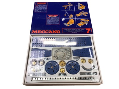 Lot 1906 - Meccano wooden box containing selection including gears, wheels, base plates.  Three boxes of early accessories 1A (1920's) and later boxed sets and lots of spares