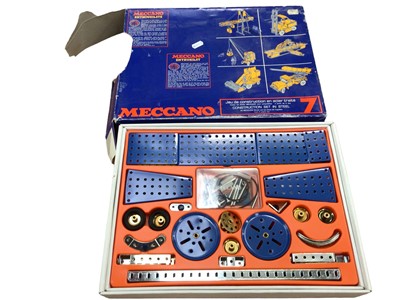 Lot 1906 - Meccano wooden box containing selection including gears, wheels, base plates.  Three boxes of early accessories 1A (1920's) and later boxed sets and lots of spares