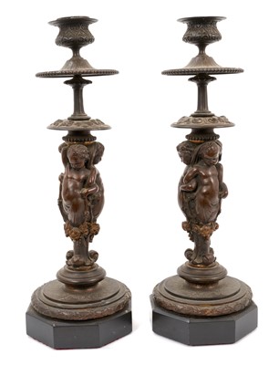 Lot 919 - Pair of 19th century Continental bronze candlesticks with putti supports