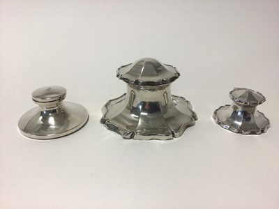 Lot 23 - Three sterling silver inkwells,the largest with scalloped edge, 12.5cm diameter, Birmingham 1919, another of similar shape and 6.5cm diameter, also Birmingham 1919, and a third of plain round form,...