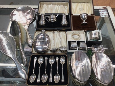 Lot 1050 - Group of silver including cruets, egg cup, napkin rings, set of six teaspoons in fitted case, dressing table set, together with a plated hip flask and pair of small plated ladles