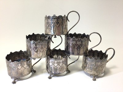 Lot 209 - Set of six silver cup holders with embossed bow and swag decoration