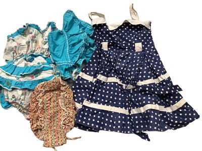 Lot 2064 - A selection of children's vintage clothing including swimsuits and dresses, two small embroidery samplers,one initiialed C.J. 1898, embroidered