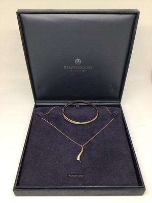 Lot 196 - 9ct gold diamond set cross over bangle and 9ct gold pendant necklace set with synthetic white stones