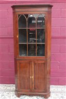 Lot 1363 - George III-style mahogany standing corner...