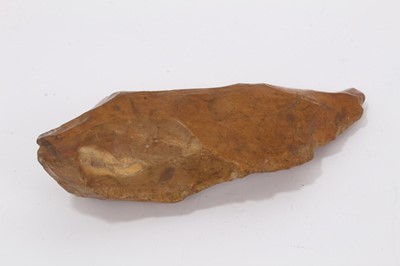 Lot 951 - Palaeolithic stone axe or knife, rich pumpkin orange patination colour, probably lower Palaeolithic culture, Acheulian, c.400,000 - 200,000 BC. Provenance: The late Edwin Rufus Walpole Eyre Collect...