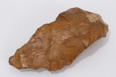 Lot 951 - Palaeolithic stone axe or knife, rich pumpkin orange patination colour, probably lower Palaeolithic culture, Acheulian, c.400,000 - 200,000 BC. Provenance: The late Edwin Rufus Walpole Eyre Collect...