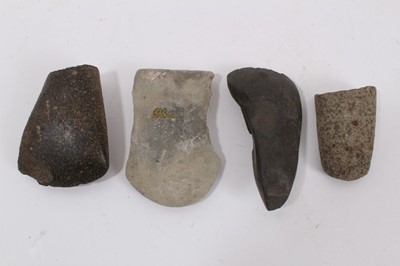 Lot 953 - Four aboriginal polished and ground-edge stone axes, two greenstone examples, one fragment and a pale stone axe with collection number. With old note of provenance noting the axes discovery in 1906...