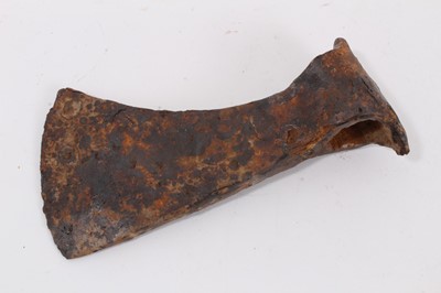 Lot 960 - Viking iron battle axe, c.700-900 AD. The curved blade extending downward, below the butt of the axehead, lozenge-shaped poll and round socket. Provenance: Private collection, Dorset, UK