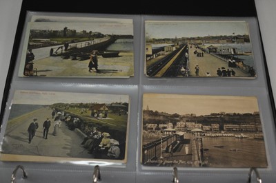 Lot 1416 - postcards in two albums including coastal cards, GB topography, real photographs etc.