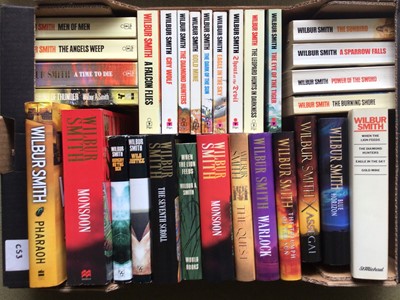 Lot 1696 - Wilbur Smith (37) and Jeffrey Archer (23) Thrillers in Hardback and Paperback (2 Boxes)