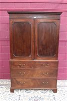 Lot 1313 - George III mahogany linen press, having dentil...