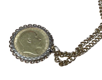 Lot 15 - Edward VII gold half sovereign, 1907, in 9ct gold pendant mount on a 9ct gold chain