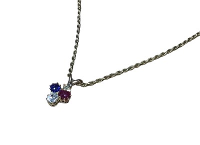 Lot 16 - Victorian diamond ruby and blue sapphire pendant in the form of a spade, on a modern 9ct gold chain