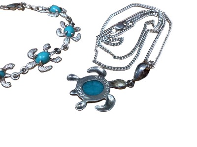 Lot 66 - Galapagos silver turtle pendant set with a turquoise colour cabochon on silver chain, together with a similar style bracelet and four silver rings
