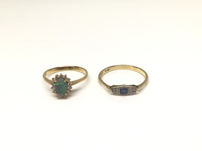 Lot 1008 - 18ct gold opal and diamond oval ring and 18ct gold sapphire and diamond three stone ring