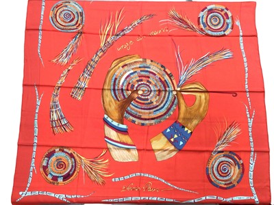 Lot 2098 - Hermès silk scarf Magie des Mains, red-orange designer Jacob Jeremiah Kyany 2002, 90 x 90cm approximately