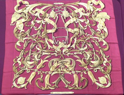 Lot 2099 - Hermès silk scarf Le Mors A La Conetable, red and gold, designer Henri d'Origny, c1970, with double tag, 90 x 90cm approximately.