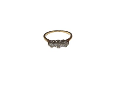 Lot 141 - Diamond three stone ring with three round brilliant cut diamonds in platinum claw setting on 18ct gold shank